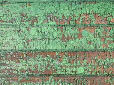 Yıpranmış boya desenli ahşap bir duvar.