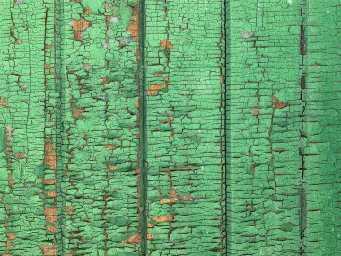 Yıpranmış boya desenli ahşap bir duvar.