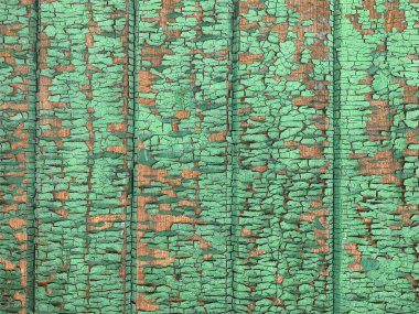 Yıpranmış boya desenli ahşap bir duvar.