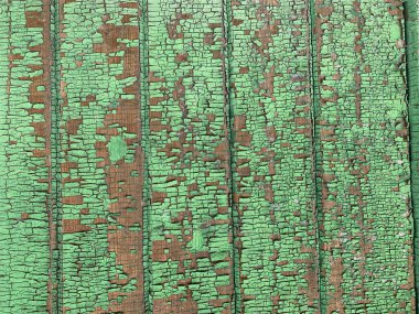 Yıpranmış boya desenli ahşap bir duvar.