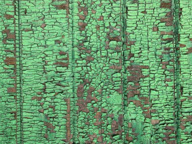 Yıpranmış boya desenli ahşap bir duvar.