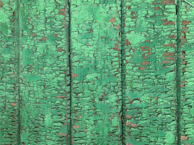 Yıpranmış boya desenli ahşap bir duvar.