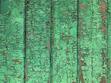 Yıpranmış boya desenli ahşap bir duvar.