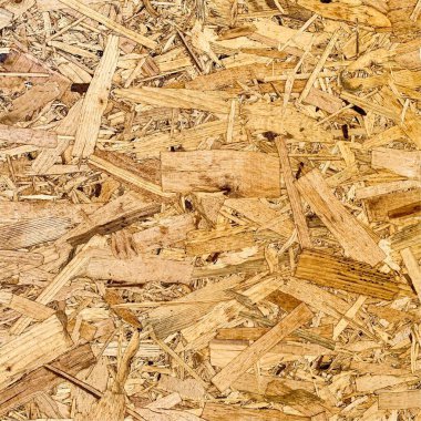 Sıkıştırılmış yonga arka planı. Ahşap zemin. OSB dokusu