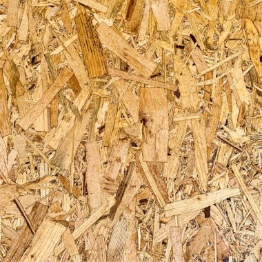 Sıkıştırılmış yonga arka planı. Ahşap zemin. OSB dokusu