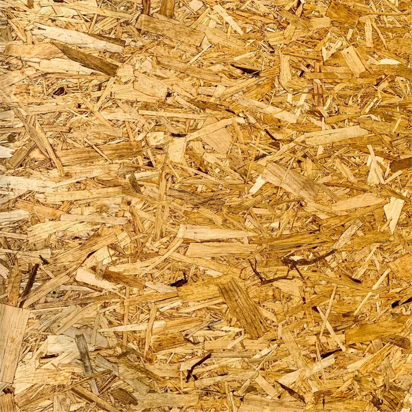 Sıkıştırılmış yonga arka planı. Ahşap zemin. OSB dokusu