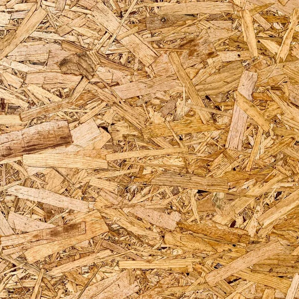 Sıkıştırılmış yonga arka planı. Ahşap zemin. OSB dokusu