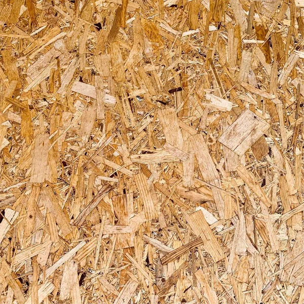 Sıkıştırılmış yonga arka planı. Ahşap zemin. OSB dokusu