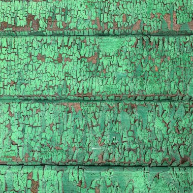 Yıpranmış boya desenli ahşap bir duvar.