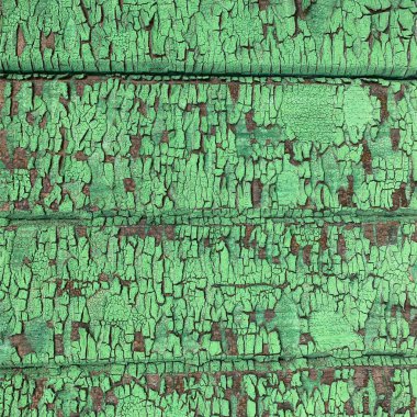 Yıpranmış boya desenli ahşap bir duvar.