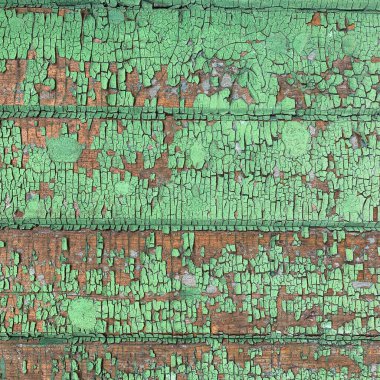 Yıpranmış boya desenli ahşap bir duvar.