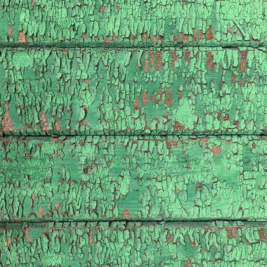 Yıpranmış boya desenli ahşap bir duvar.