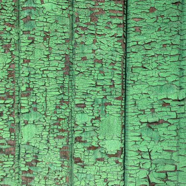 Yıpranmış boya desenli ahşap bir duvar.