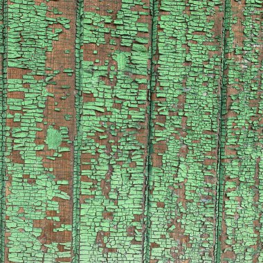 Yıpranmış boya desenli ahşap bir duvar.