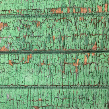 Yıpranmış boya desenli ahşap bir duvar.