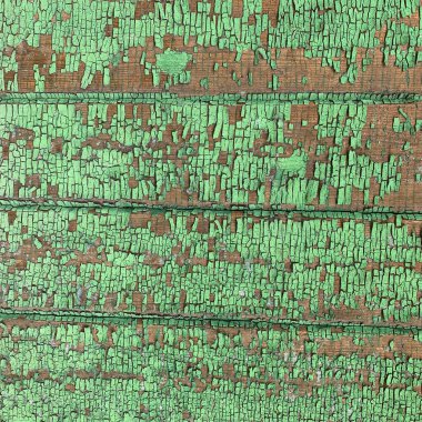 Yıpranmış boya desenli ahşap bir duvar.