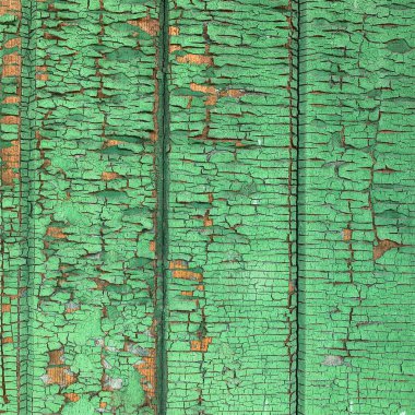 Yıpranmış boya desenli ahşap bir duvar.