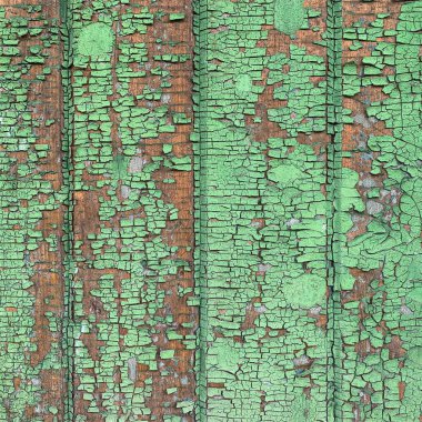 Yıpranmış boya desenli ahşap bir duvar.