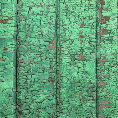 Yıpranmış boya desenli ahşap bir duvar.