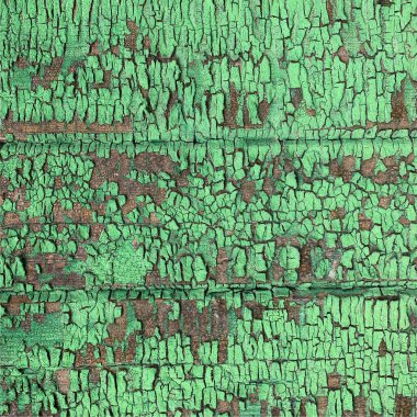 Yıpranmış boya desenli ahşap bir duvar.