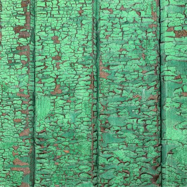 Yıpranmış boya desenli ahşap bir duvar.