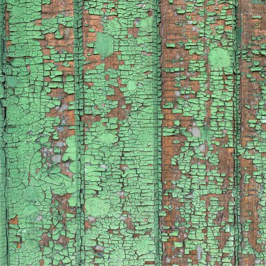 Yıpranmış boya desenli ahşap bir duvar.