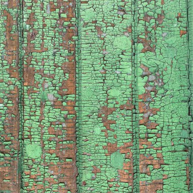 Yıpranmış boya desenli ahşap bir duvar.