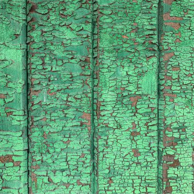 Yıpranmış boya desenli ahşap bir duvar.