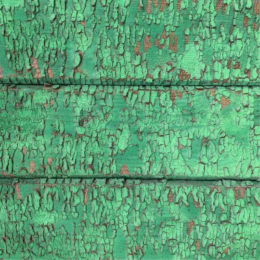 Yıpranmış boya desenli ahşap bir duvar.