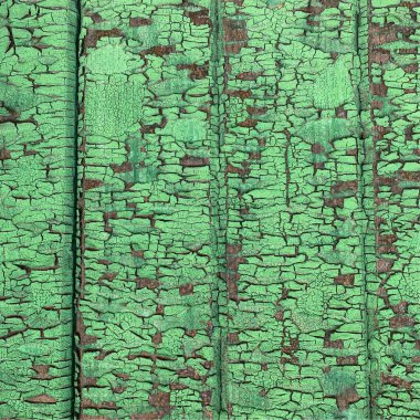 Yıpranmış boya desenli ahşap bir duvar.