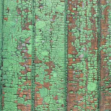 Yıpranmış boya desenli ahşap bir duvar.