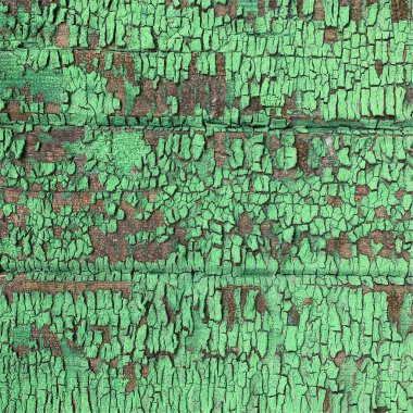 Yıpranmış boya desenli ahşap bir duvar.