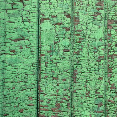 Yıpranmış boya desenli ahşap bir duvar.