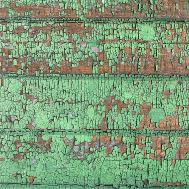 Yıpranmış boya desenli ahşap bir duvar.