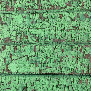 Yıpranmış boya desenli ahşap bir duvar.