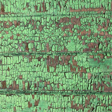 Yıpranmış boya desenli ahşap bir duvar.