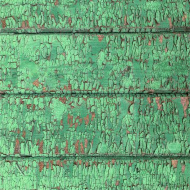 Yıpranmış boya desenli ahşap bir duvar.