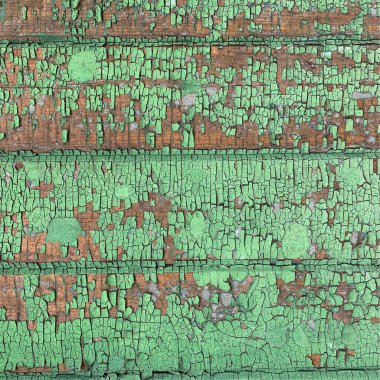 Yıpranmış boya desenli ahşap bir duvar.