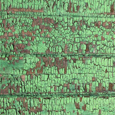 Yıpranmış boya desenli ahşap bir duvar.