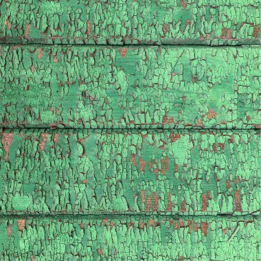 Yıpranmış boya desenli ahşap bir duvar.