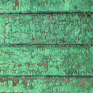 Yıpranmış boya desenli ahşap bir duvar.