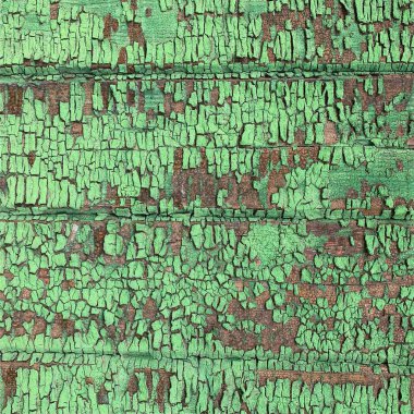 Yıpranmış boya desenli ahşap bir duvar.