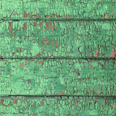 Yıpranmış boya desenli ahşap bir duvar.