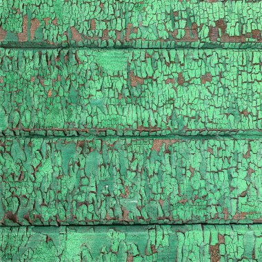 Yıpranmış boya desenli ahşap bir duvar.