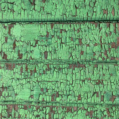 Yıpranmış boya desenli ahşap bir duvar.