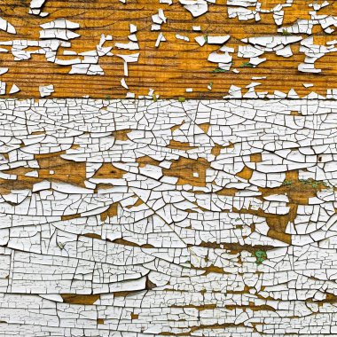 Yıpranmış boya desenli ahşap bir duvar.