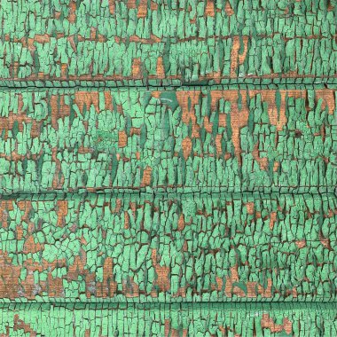 Yıpranmış boya desenli ahşap bir duvar.