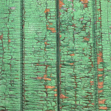 Yıpranmış boya desenli ahşap bir duvar.