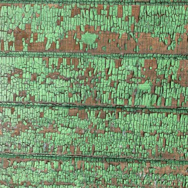 Yıpranmış boya desenli ahşap bir duvar.