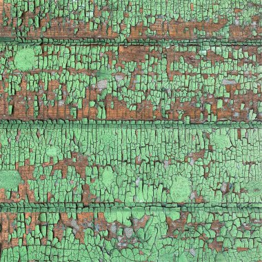 Yıpranmış boya desenli ahşap bir duvar.